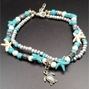 Surfing and sun turtle charm bracelet. B511